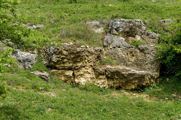 General view toward sedimentary  boulder in the field, Ludogorie, Bulgaria