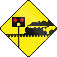 Warning road sign in Ireland - Level crossing with signals ahead