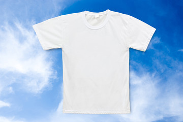 White blank T-shirt on blue sky background