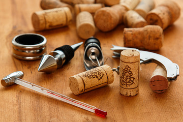 Different wine tools and corks - obrazy, fototapety, plakaty