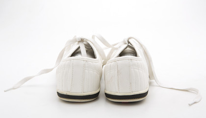 Pair of new white sneakers on white background