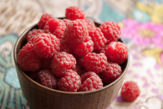 raspberries in wooden bowl
