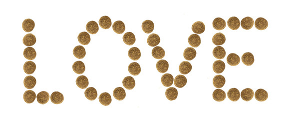 Multicolored inscription  made of dry pet food.