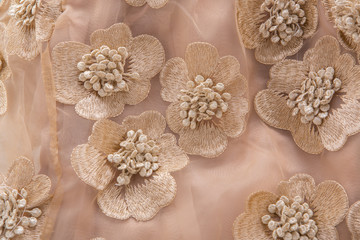 Pink fabric flower isolated on a white background.