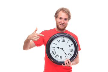 Bearded happy man holding big clock and smiling