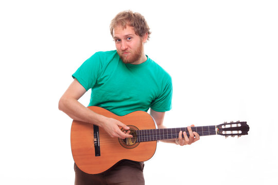 Young Bearded Man Playing Guitar