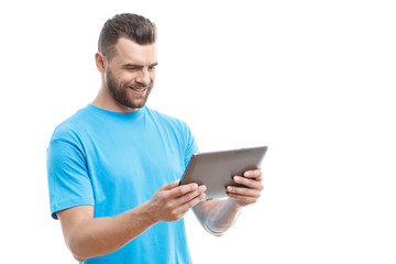 Man with beard holding tablet 