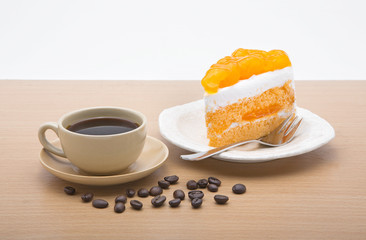 cup of coffee and delicious cake on white background