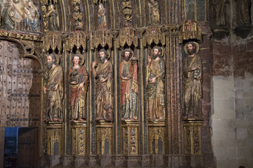 Detail of the wood carved polychrome portal from the 14th century in the Church of Santa Maria de...