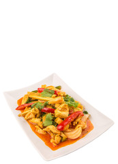 Malaysian traditional dish of Ayam Paprik or spicy stir fry chicken on white plate over white background