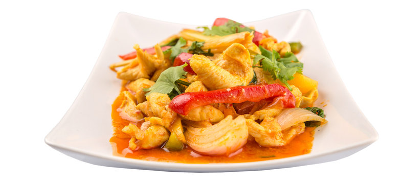 Malaysian traditional dish of Ayam Paprik or spicy stir fry chicken on white plate over white background
