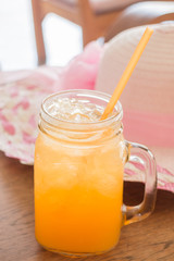 Fresh orange juice serving on wooden table