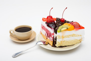 cup of coffee and delicious cake on white background