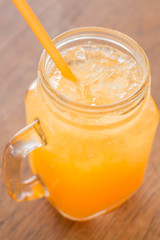 Fresh orange juice serving on wooden table