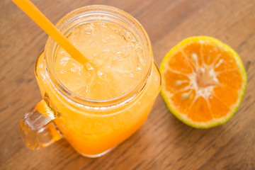 Fresh orange juice serving on wooden table
