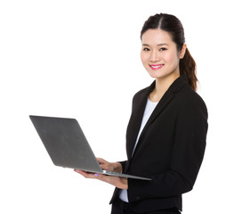 Confident Businesswoman use of the notebook computer