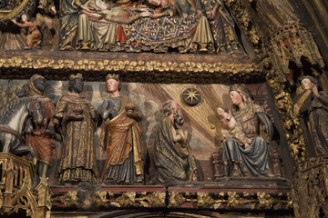 Fototapeta na wymiar Detail of the wood carved polychrome portal from the 14th century in the Church of Santa Maria de los Reyes(Saint Mary of the Kings)Laguardia,Spain