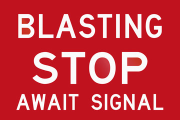 An Australian temporary road sign - Blasting, stop and await signal
