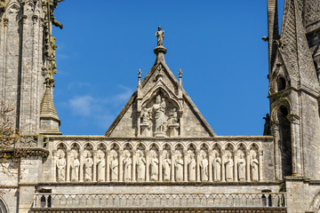 Group of sculptures above Royal Portal of Cathedral Our Lady of