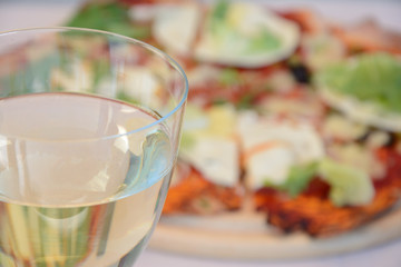 Glass of wine and pizza