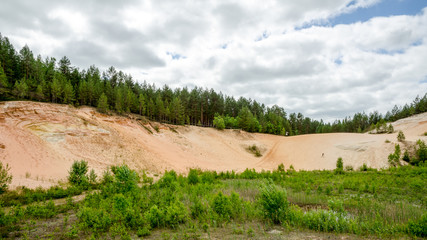 Panorama mountain sand quarry with a man
