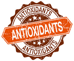antioxidants orange round grunge stamp on white
