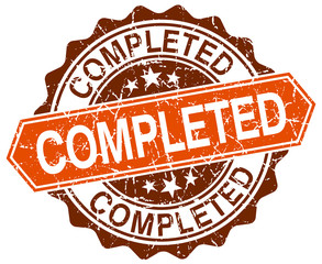 completed orange round grunge stamp on white