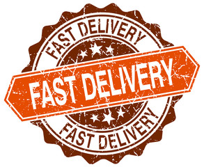 fast delivery orange round grunge stamp on white