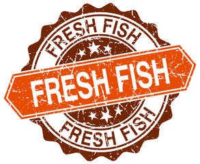 fresh fish orange round grunge stamp on white