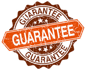 guarantee orange round grunge stamp on white