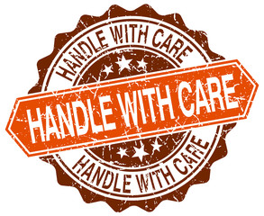 handle with care orange round grunge stamp on white