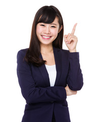 Asian young businesswoman with finger point up