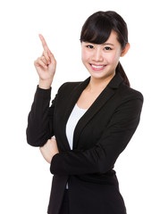 Young businesswoman with finger point up