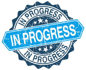 Fototapeta premium in progress blue round grunge stamp on white