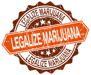Obraz premium legalize marijuana orange round grunge stamp on white