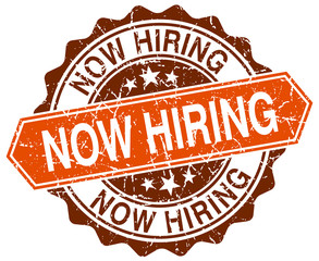 now hiring orange round grunge stamp on white