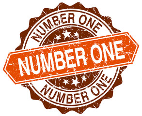 number one orange round grunge stamp on white