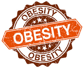 Obraz premium obesity orange round grunge stamp on white