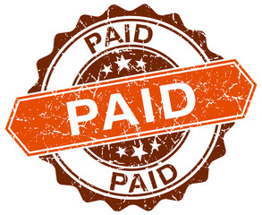 Obraz premium paid orange round grunge stamp on white