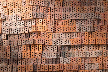 stack of old orange brick background  with light from corner