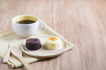 Hokkaido cheesecake with coffee cup with wooden background