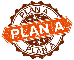 plan a orange round grunge stamp on white