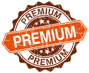 premium orange round grunge stamp on white
