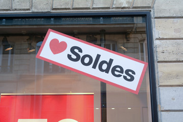 Obraz premium Love Soldes sign in shop window in France