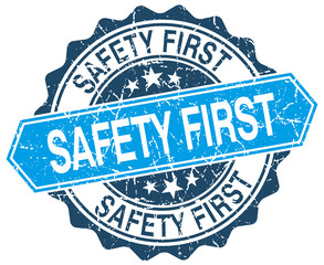 Obraz premium safety first blue round grunge stamp on white