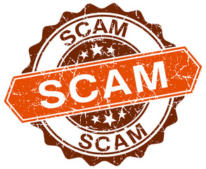 Obraz premium scam orange round grunge stamp on white