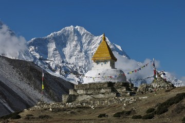 Stupa and snow capped mountain Thamserku