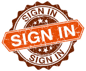 sign in orange round grunge stamp on white