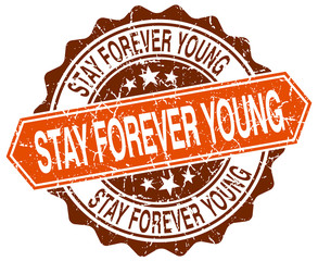 Obraz premium stay forever young orange round grunge stamp on white