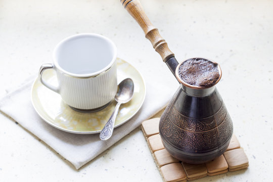 Cezve of turkish coffee and cup